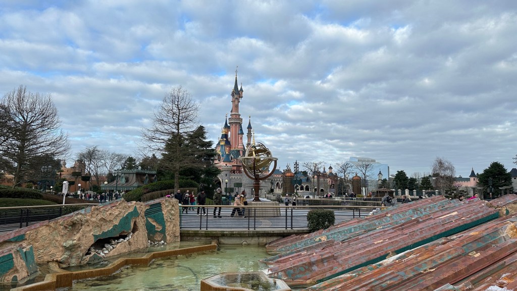 Sleeping Beauty Castle in Disneyland Paris with rockwork around