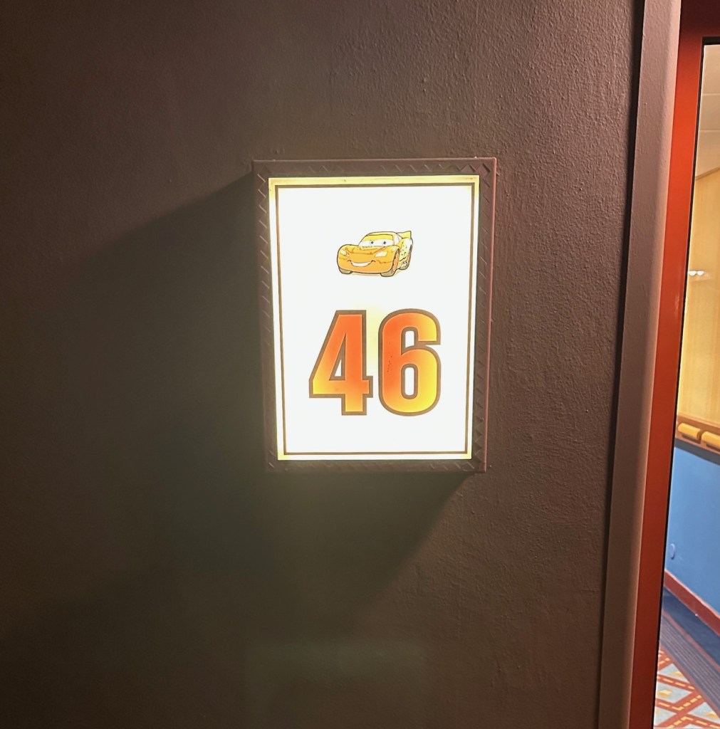 Sign for building 46 at Disney's Hotel Santa Fe resort at Disneyland Paris with a picture of Lightning McQueen from Cars