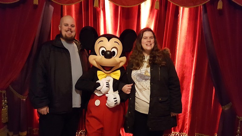 Man and woman with Mickey Mouse