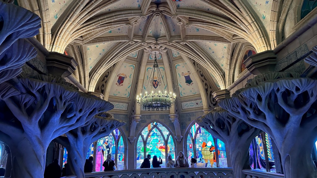 Stained glass windows and vaulted ceilings inside Sleeping Beauty Castle in Disneyland Paris