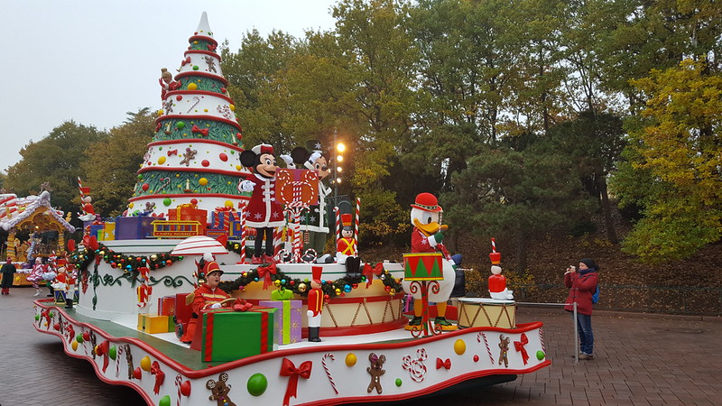 Christmas themed parade float with Disney characters from Disneyland Paris