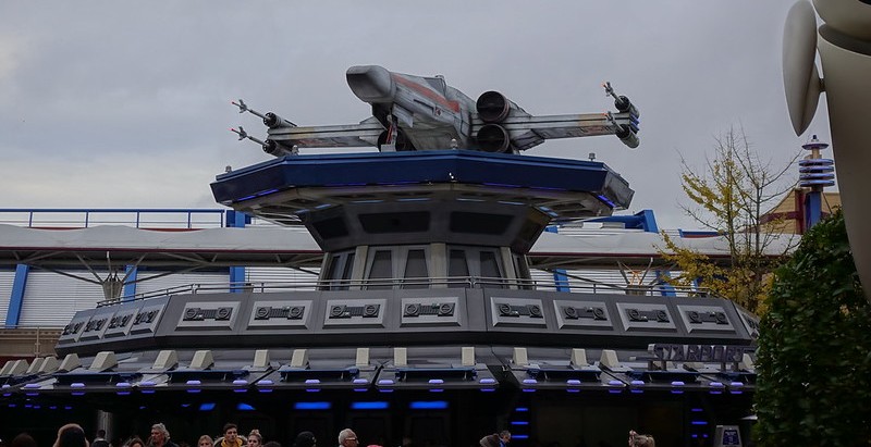 Model X Wing spaceship sitting on top of building in Disneyland Paris