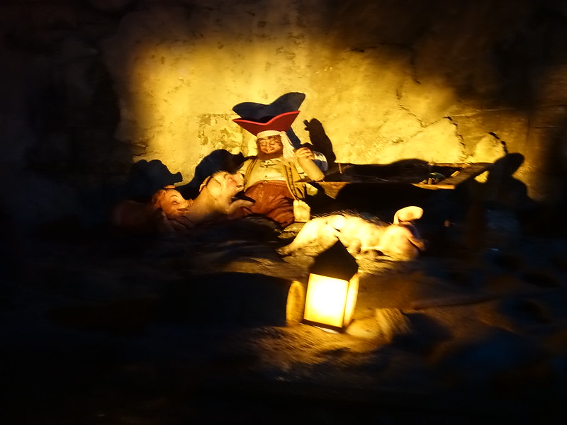 Pirate asleep with pigs on the Pirates of the Caribbean ride at Disneyland Paris