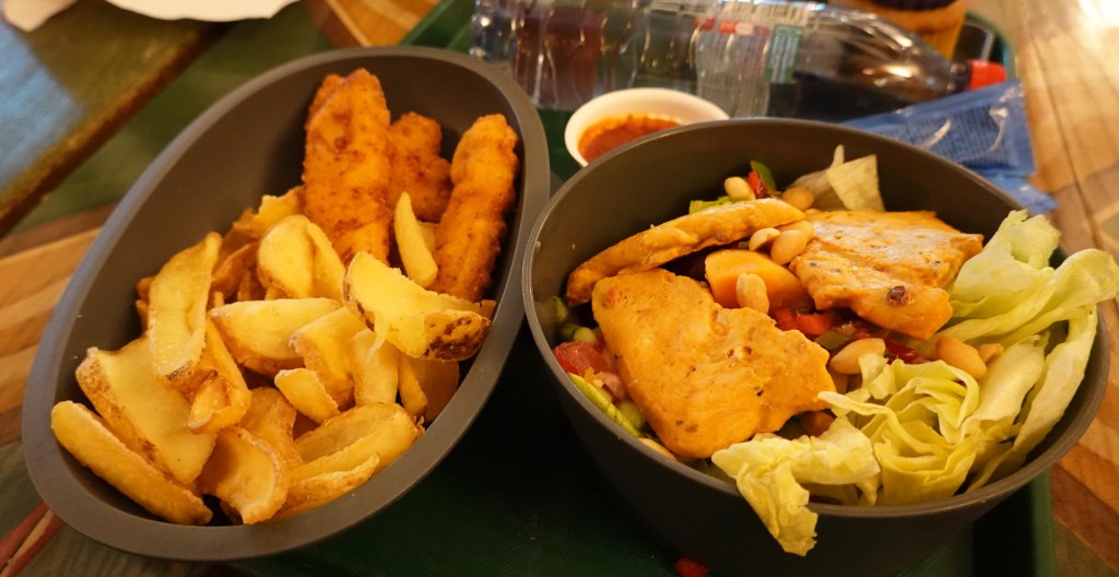 CHicken and chips and a salad with chicken from Restaurant Hakuna Matata at Disneyland Paris