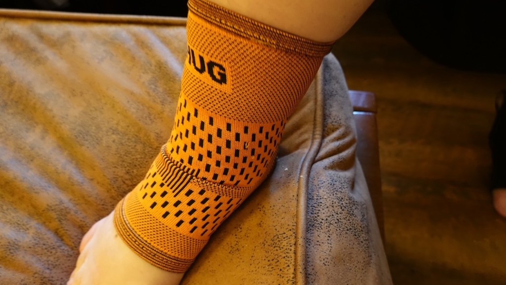 ANkle with orange Bearhug ankle support on it