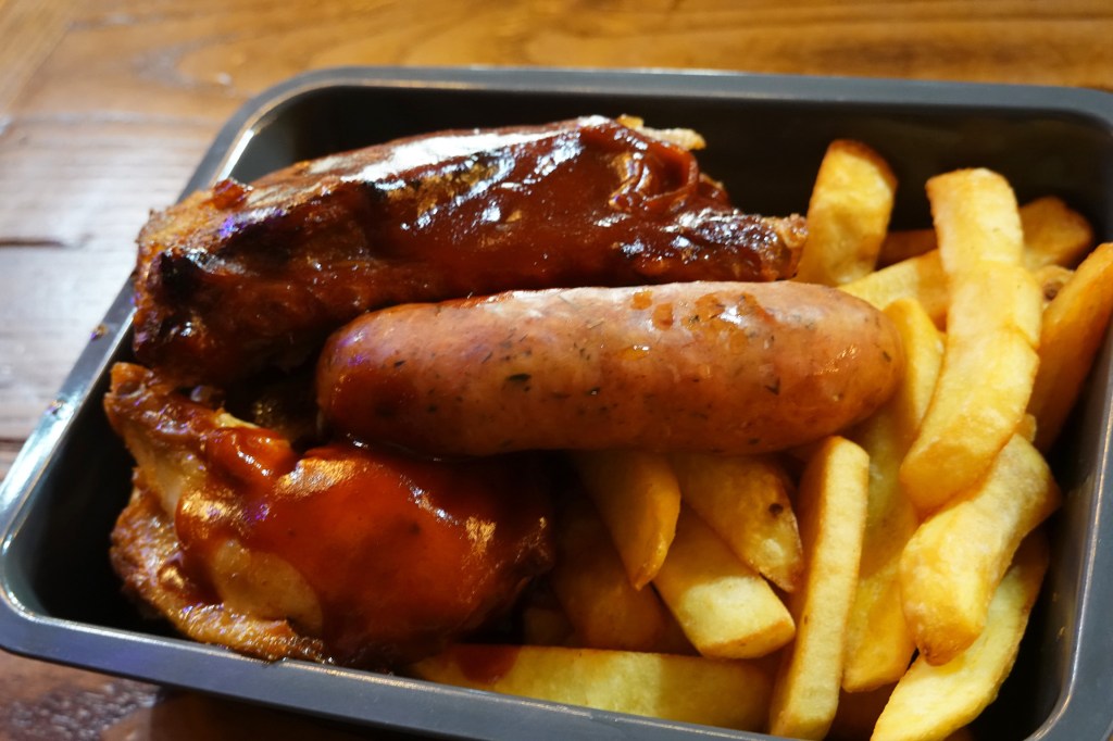 Sausage, ribs, chicken and chips from the Cowboy Cookout Restaurant in Disneyland Paris