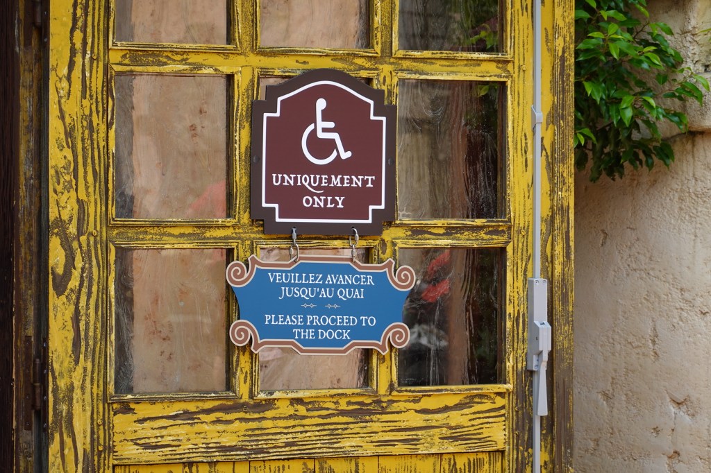Door with wheelchair sign on it at Pirates of the Caribbean in Disneyland Paris