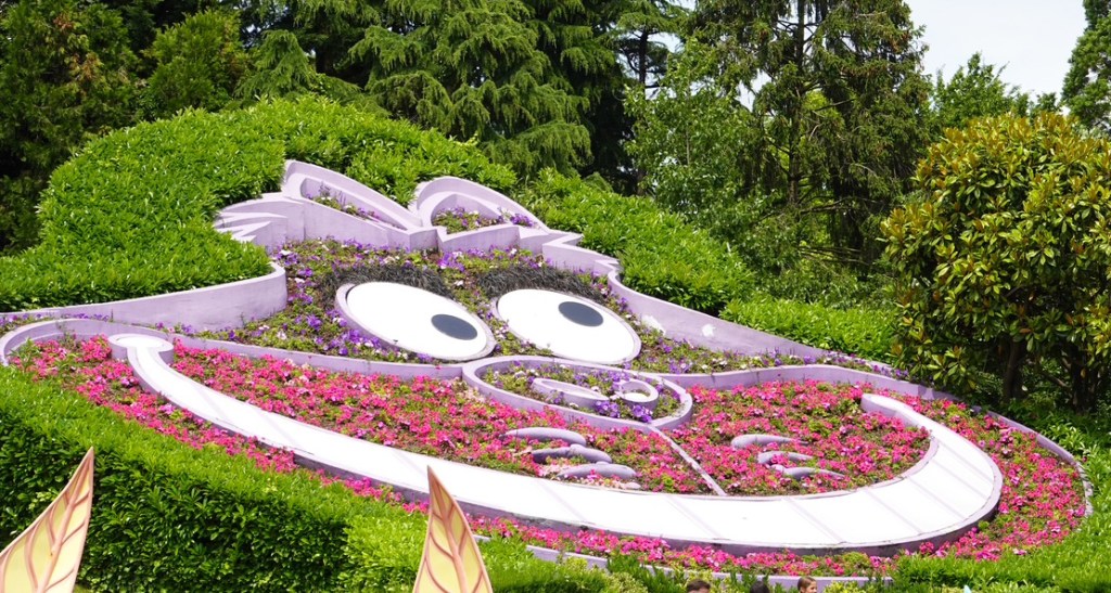 Flower bed in the shape of the head of the Cheshire Cat from Alice in Wonderland, at Disneyland Paris