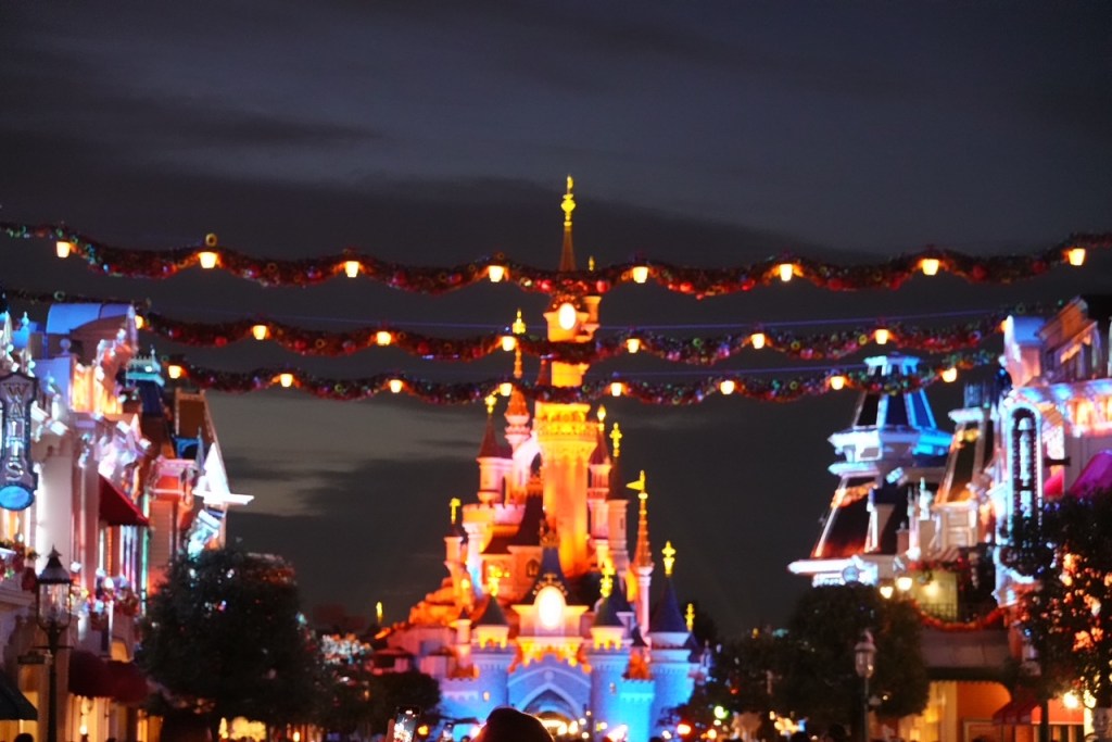 Disneyland Paris Main Street USA at night with Halloween decor