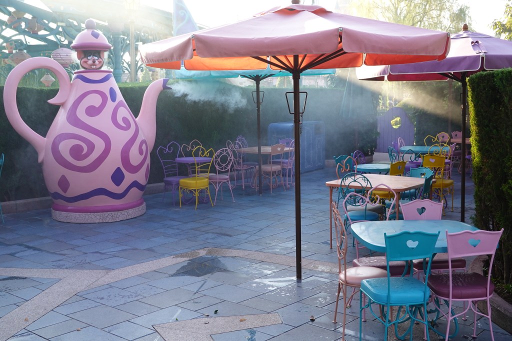 Dormouse popping out of a teapot in an Alice in Wonderland themed seating area in Disneyland Paris