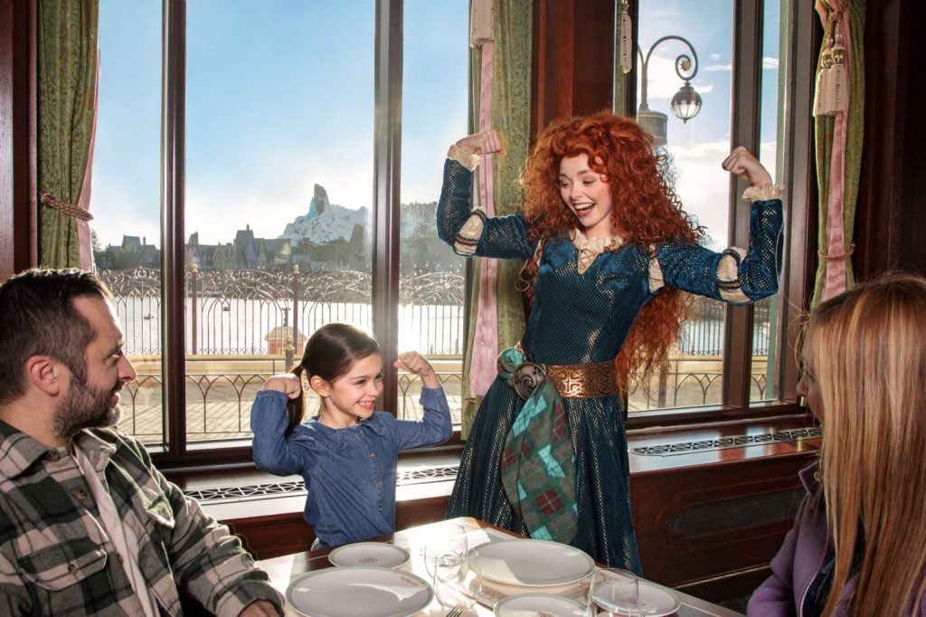 Merida and young guest in restaurant at Disneyland Paris