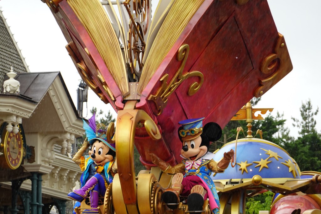 Mickey and Minnie Mouse on a parade float at Disneyland Paris