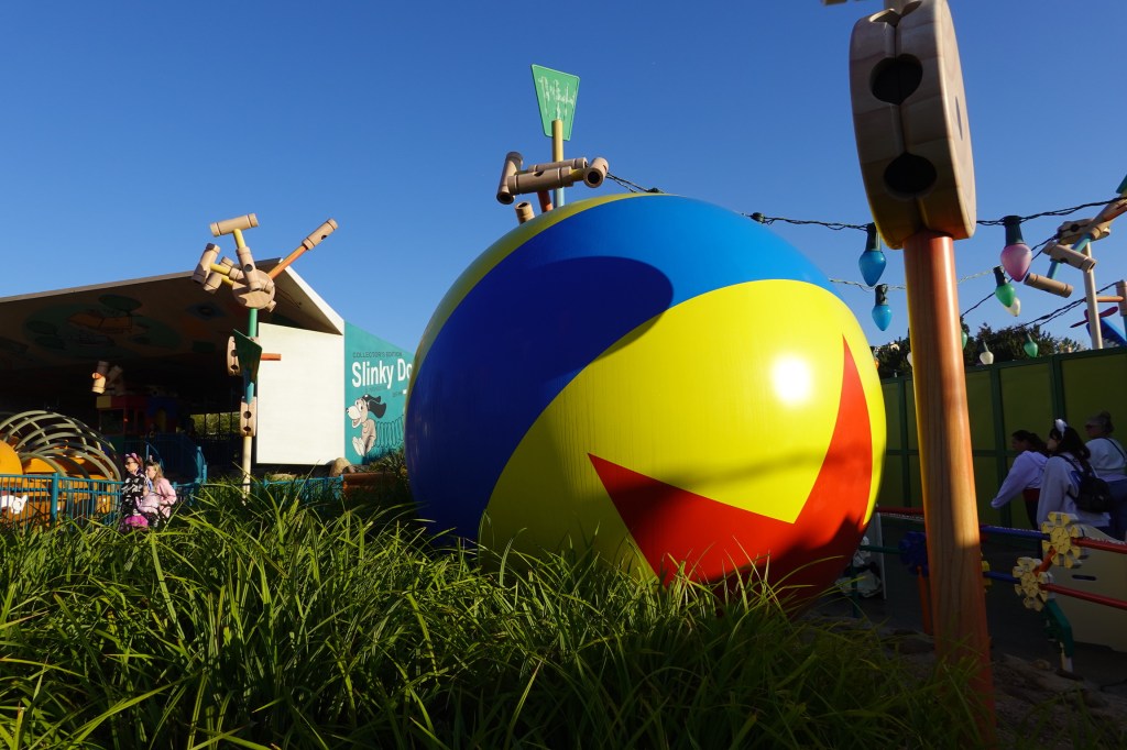 Large Pixar ball next to Slinky Dog ride in Disneyland Paris