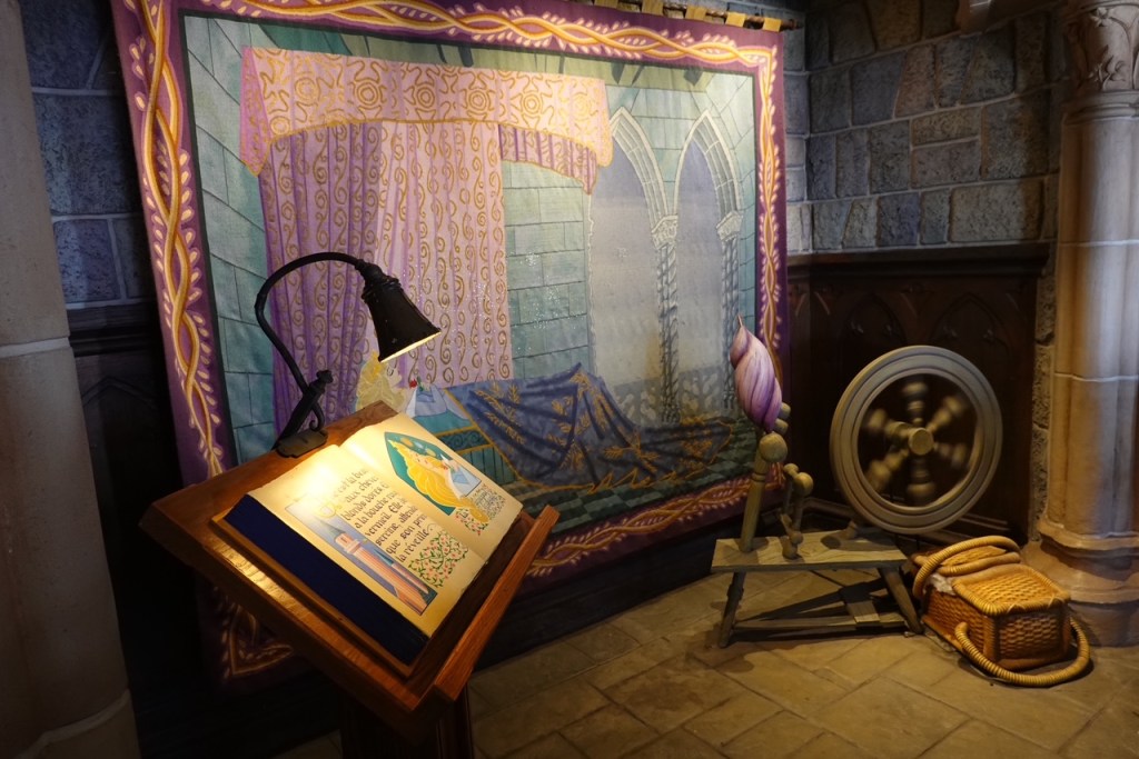 Tapestry and spinning wheel model from the Sleeping Beauty walkthrough attraction at Disneyland Paris
