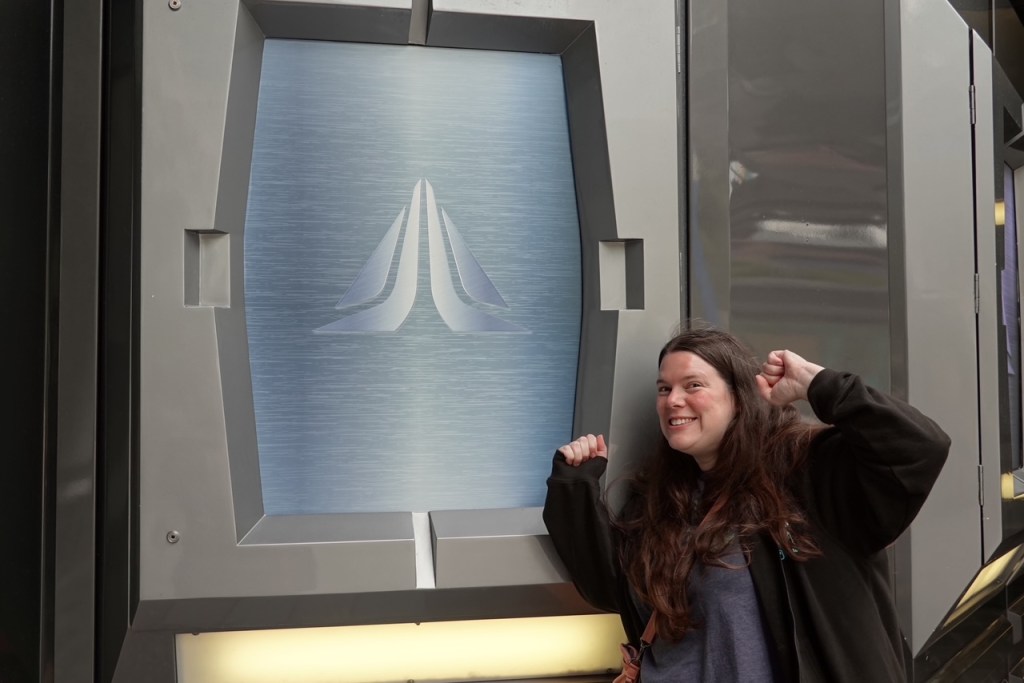 Woman next to Star Tours sign in Disneyland Paris