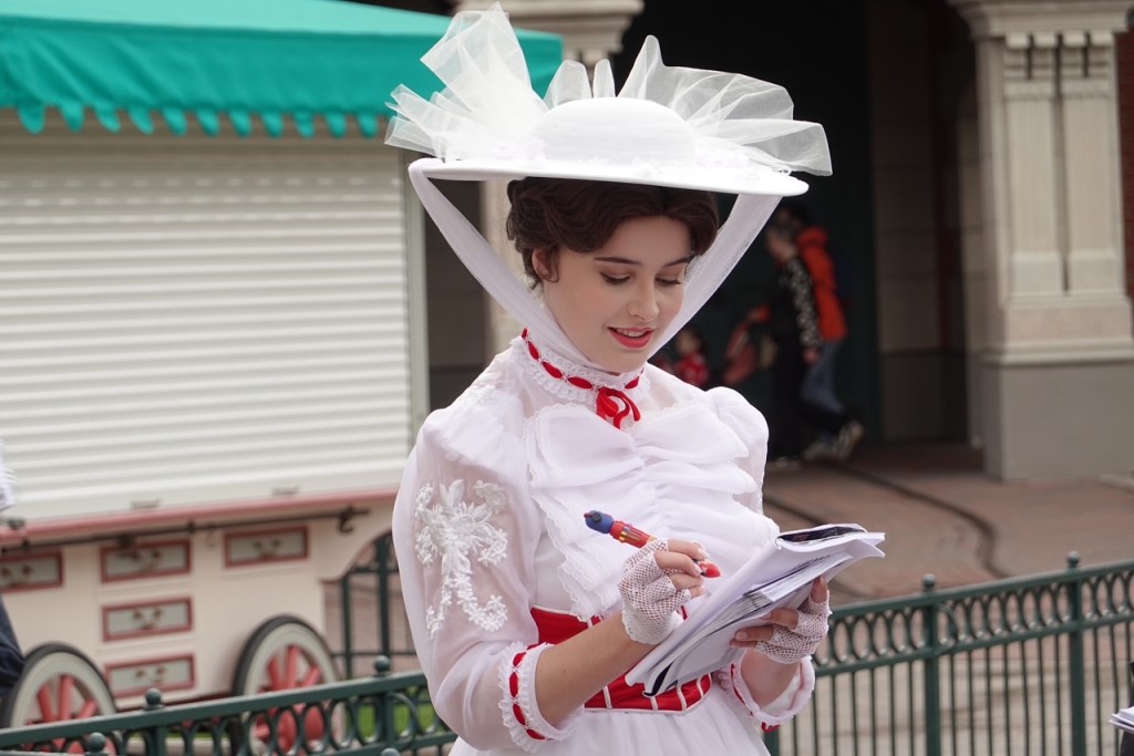 Mary Poppins signing an autograph at Disneyland Paris