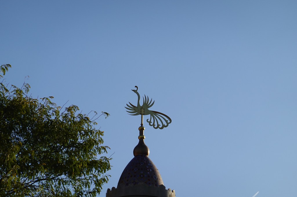 Phoenix weathervane on top of the Adventureland entrance pavilion in Disneyland Paris