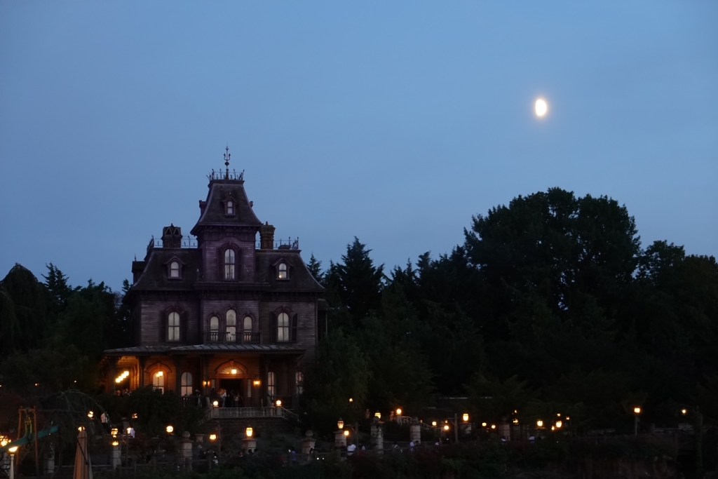 Phantom Manor in Disneyland Paris with a full moon